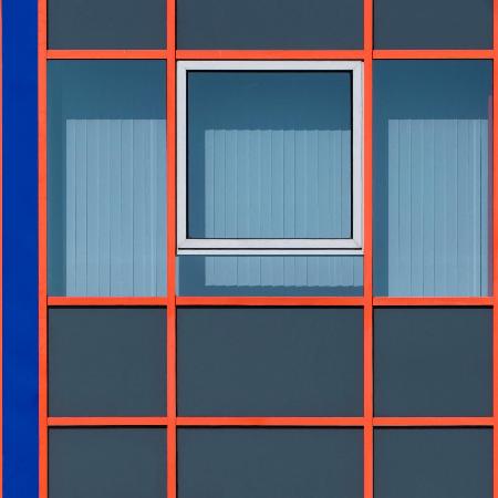 Graphic facade with a white window