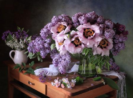 Still life with a bouquet of peonies and lilacs
