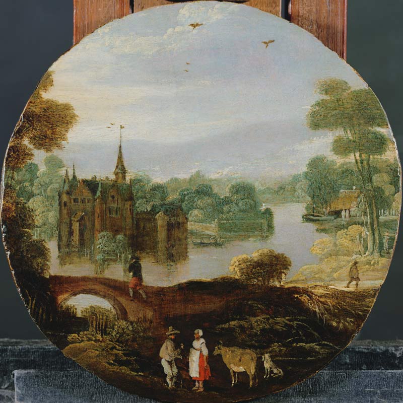 A wooded river landscape with a castle and travellers conversing from Tobias Verhaecht