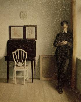 Interior with reading young man