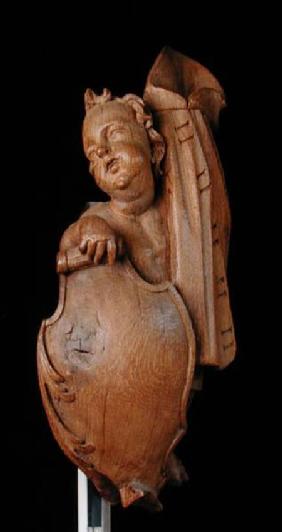 Carved putto with shield and cape
