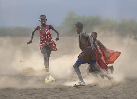 Masai children playing soccer